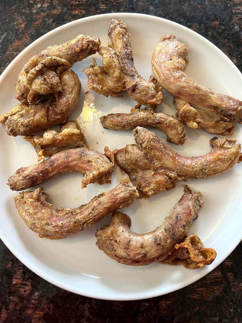 Plate of crispy, golden-brown air fryer chicken necks ready to serve, fresh from the Air Fryer Chicken Necks recipe.