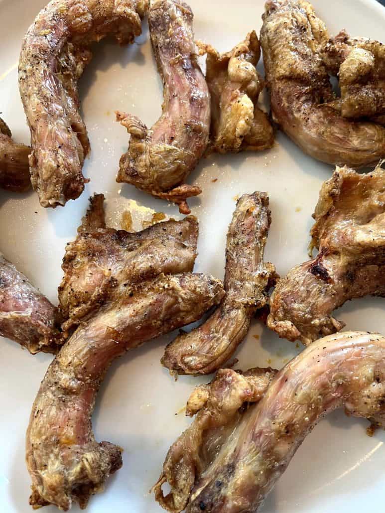 Close-up of air-fried chicken necks served on a plate, highlighting their crispy skin and juicy texture from the Air Fryer Chicken Necks recipe.