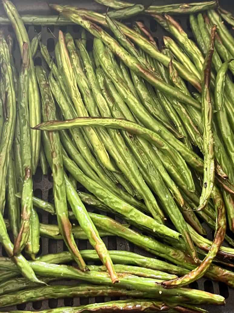 Crispy air-fried French green beans (Haricot Verts) showing golden brown edges and perfect texture from the Air Fryer French Green Beans recipe.
