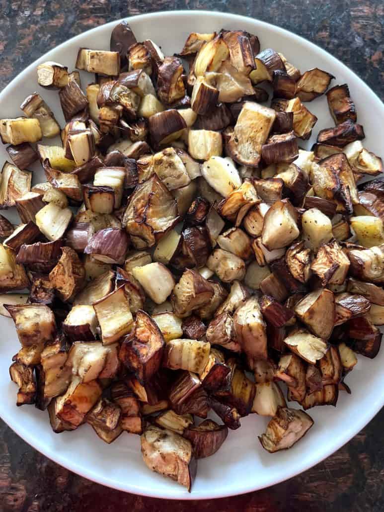Air-fried graffiti eggplant cubes served on a white plate, ready to enjoy.