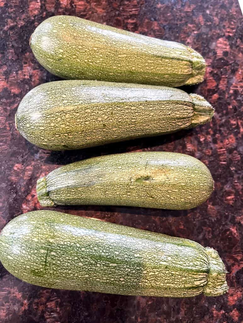 Raw Lita squash on kitchen counter, ready to be chopped for air frying.