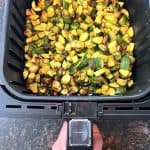 Cooked air fryer Lita squash in basket, crispy and golden after 20 minutes at 400°F".