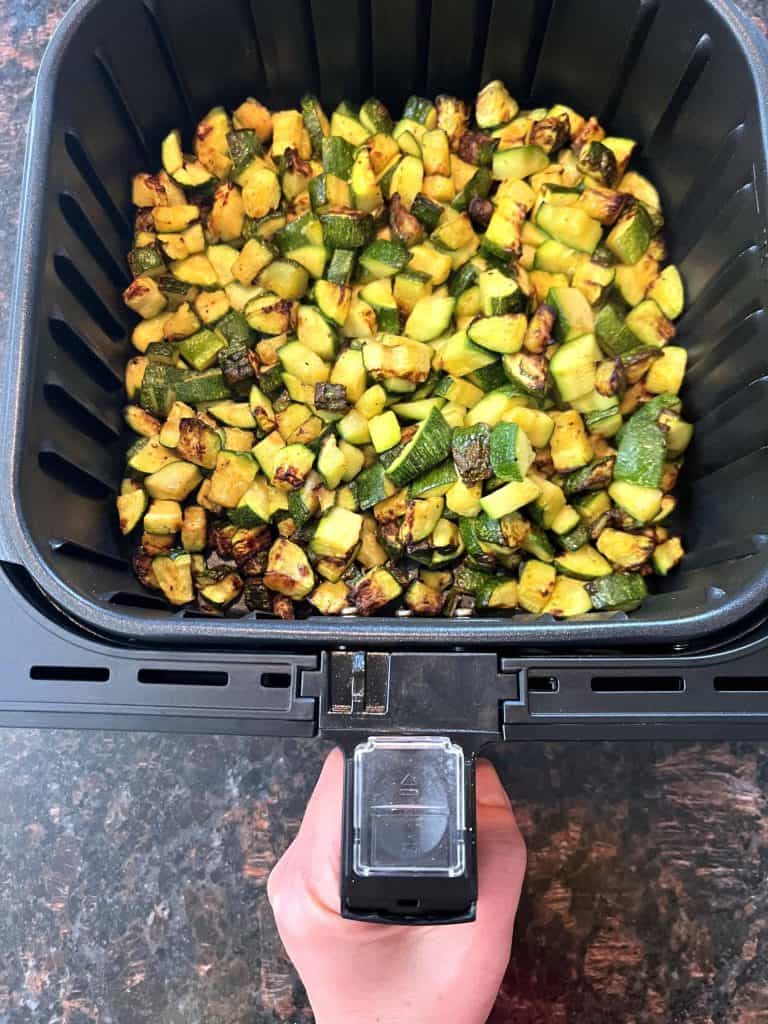 Cooked air fryer Lita squash in basket, crispy and golden after 20 minutes at 400°F".