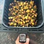 Crispy air fryer okra and potatoes fresh out of the basket, perfectly browned and ready to serve as a flavorful, healthy side dish.