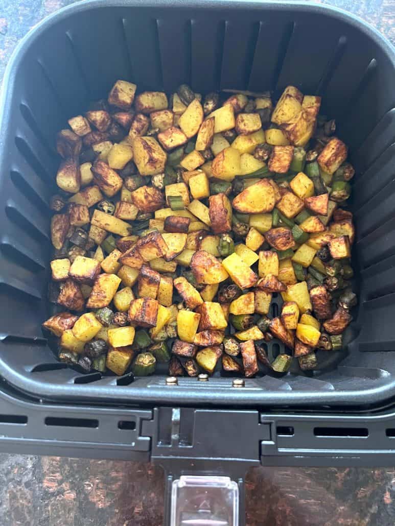 Crispy air fryer okra and potatoes after cooking, showing perfectly roasted edges and a golden finish.