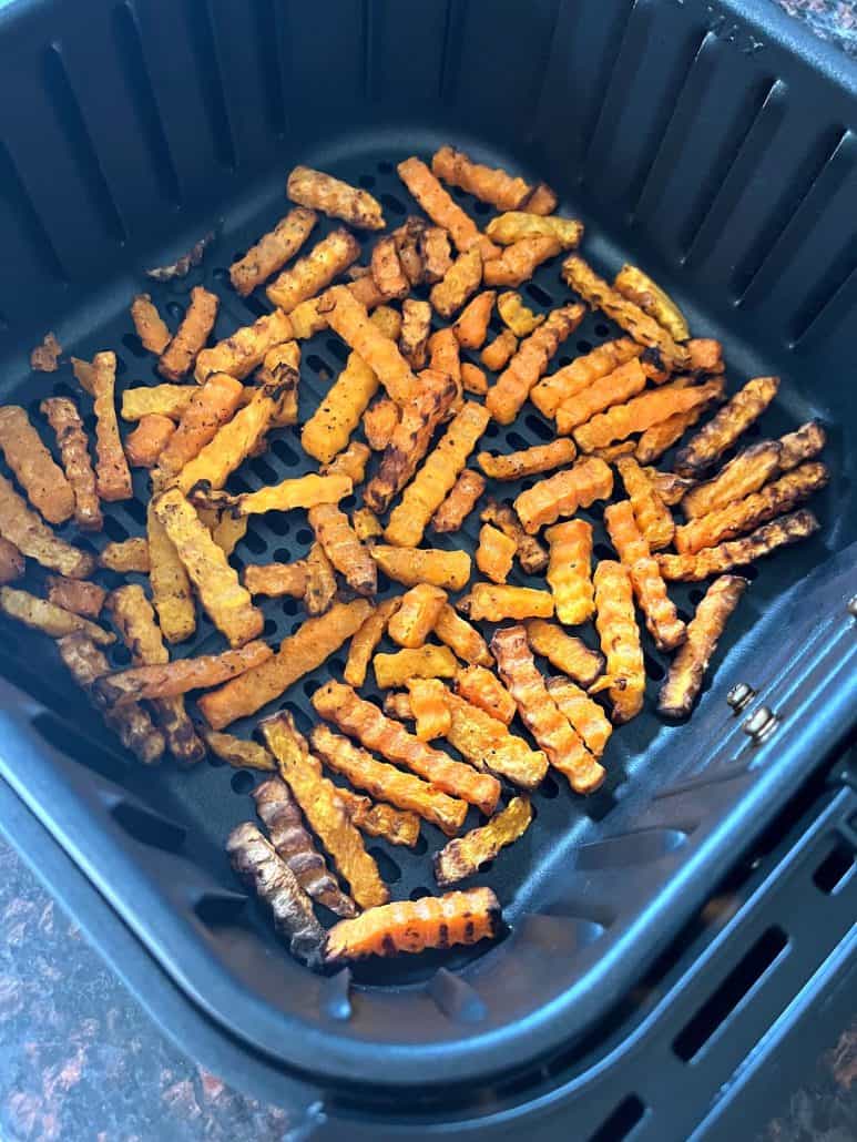 Close-up of golden brown Trader Joe’s Butternut Squash Zig-Zags just finished cooking in the air fryer—crispy, tender, and ready to serve.