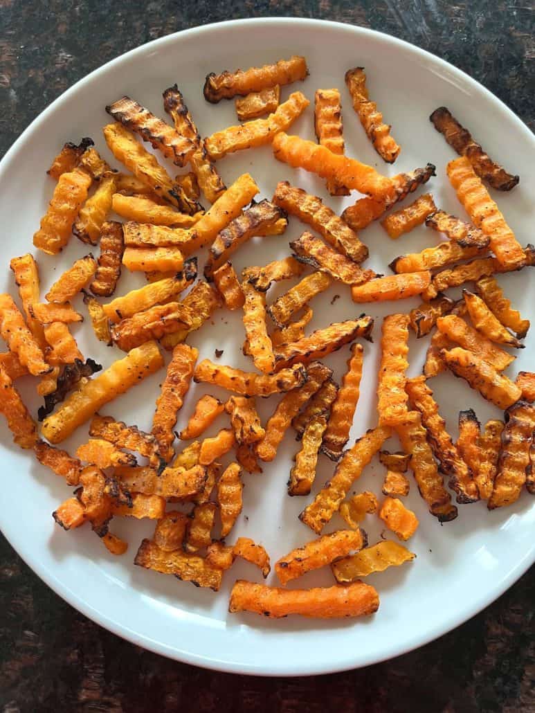 Plate of crispy air-fried Trader Joe’s Butternut Squash Zig-Zags, served hot and ready to enjoy.