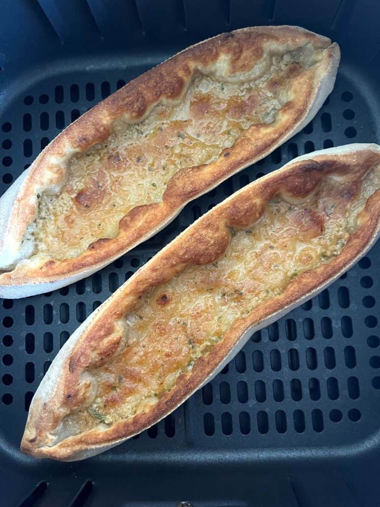 Top view of two Trader Joe’s Garlic Gondolas perfectly air fried to a golden crisp.