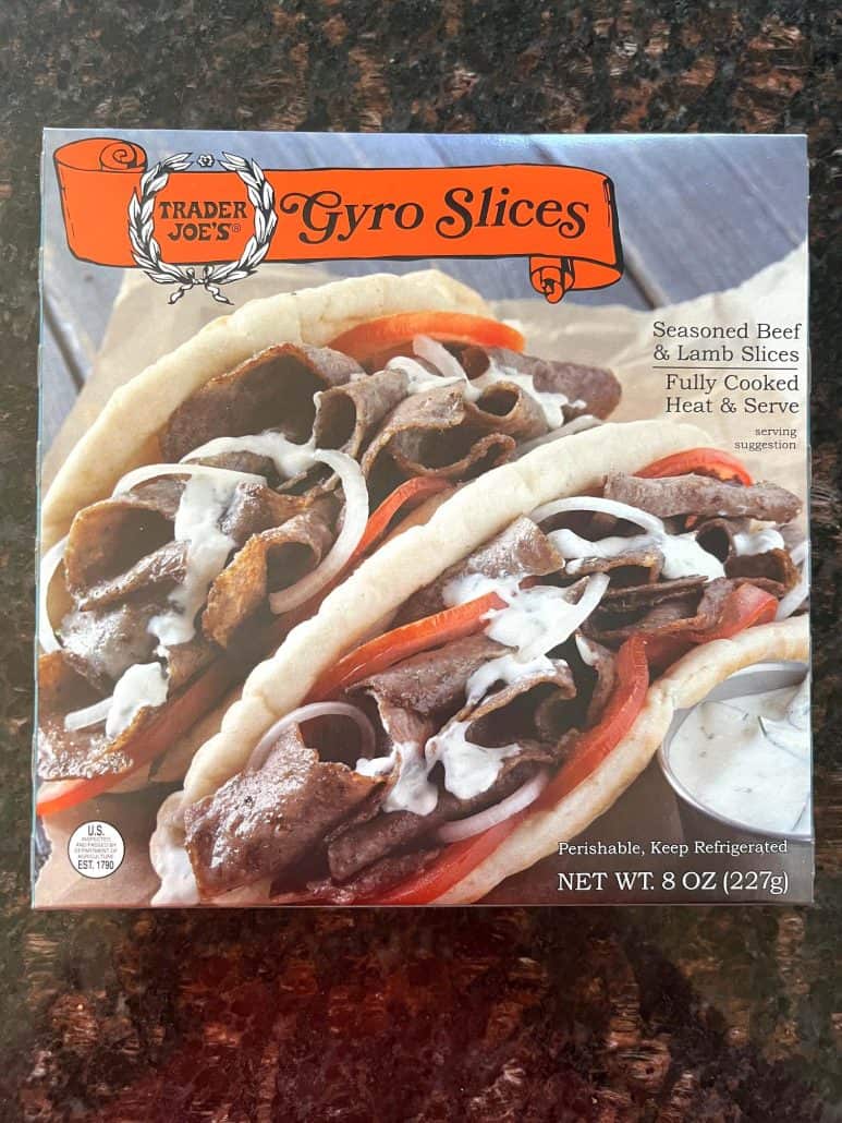 Package of Trader Joe’s Gyro Slices showing serving suggestion with pita, tomatoes, and tzatziki sauce.