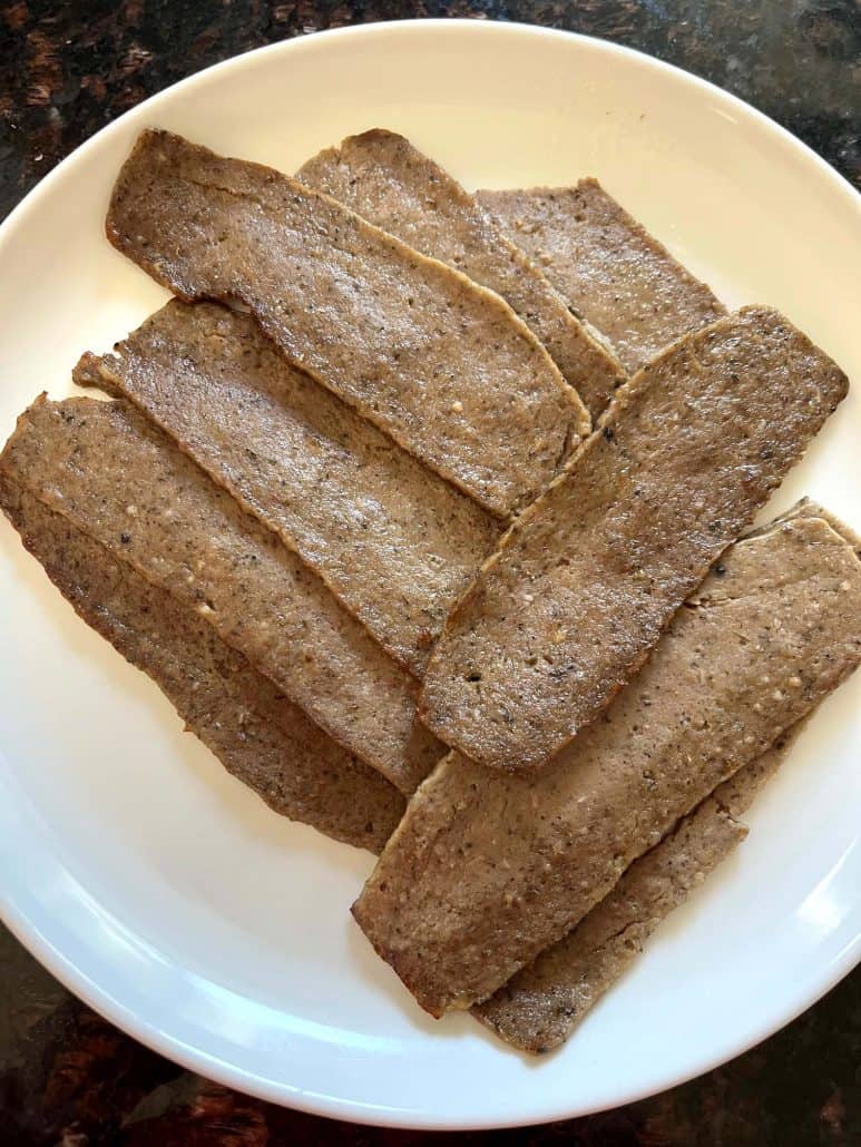 Cooked Trader Joe’s gyro slices served on a white plate after air frying, ready to eat or add to a meal.