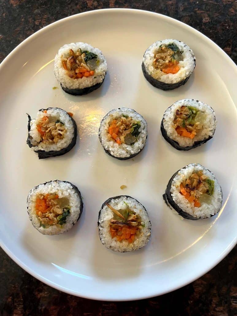 Plate of cooked Trader Joe's kimbap rolls, neatly arranged and ready to serve.