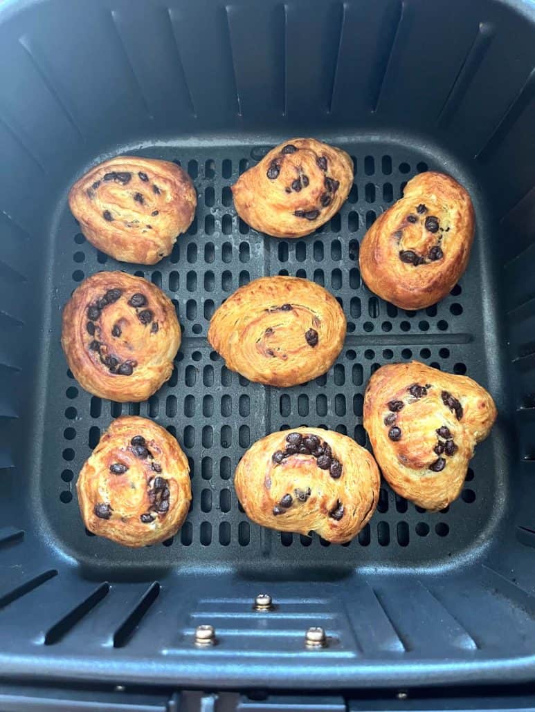 Air fryer basket filled with perfectly baked and golden-brown Trader Joe’s Mini Croissants.