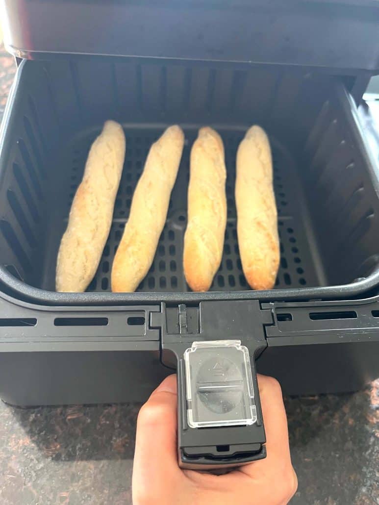 Cooked Trader Joe’s mini French baguettes fresh out of the air fryer, golden and ready to serve.