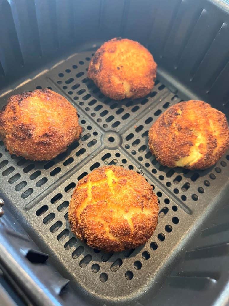 Golden brown Trader Joe’s Papas Rellenas just finished cooking in the air fryer basket.
