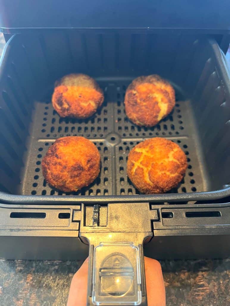 Freshly air-fried Trader Joe’s Papas Rellenas in the basket, perfectly browned and ready to serve.