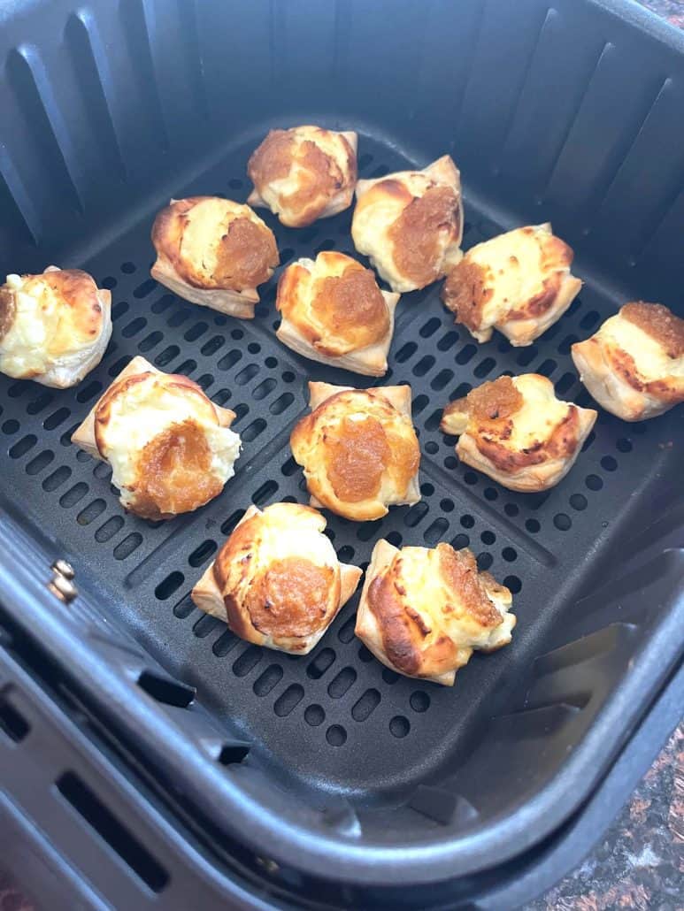 Golden brown Trader Joe’s Pastry Bites inside the air fryer basket, showing their crispy texture fresh after cooking.
