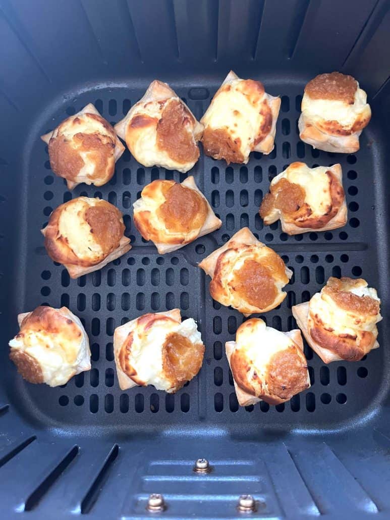 Top view of crispy Trader Joe’s Pastry Bites in the air fryer basket, freshly cooked and golden brown after air frying.
