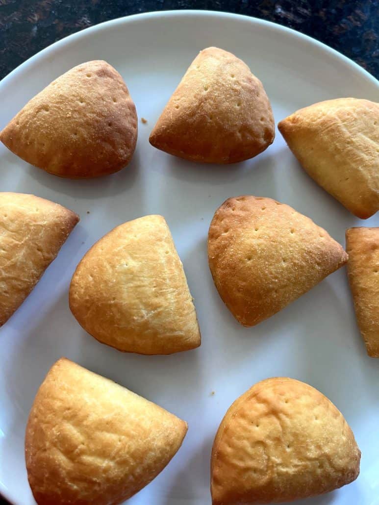 Golden air-fried Trader Joe’s Panzerotti Pizza Bites arranged on a plate—freshly cooked.
