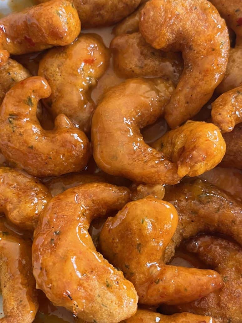 Extreme close-up of sauced Trader Joe’s Shrimp Boom Bah—crispy air fryer shrimp coated in a sweet and spicy glaze.