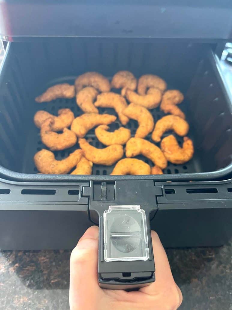 Trader Joe’s Shrimp Boom Bah cooking in an air fryer basket—crispy and golden.
