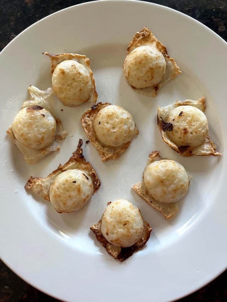 Air-fried Trader Joe’s Thai Coconut Pancakes (Kanom Krok) plated and ready to serve for a quick and tasty dessert.