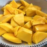 Bowl filled with freshly cut Philippine Carabao (Manila) mango slices, ready to serve or use in mango-based recipes.