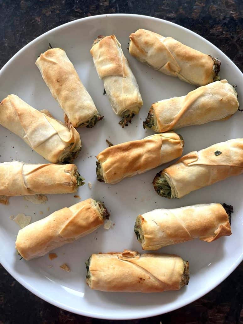 Crispy borek bites arranged on a white plate—fresh from the air fryer and ready to enjoy.