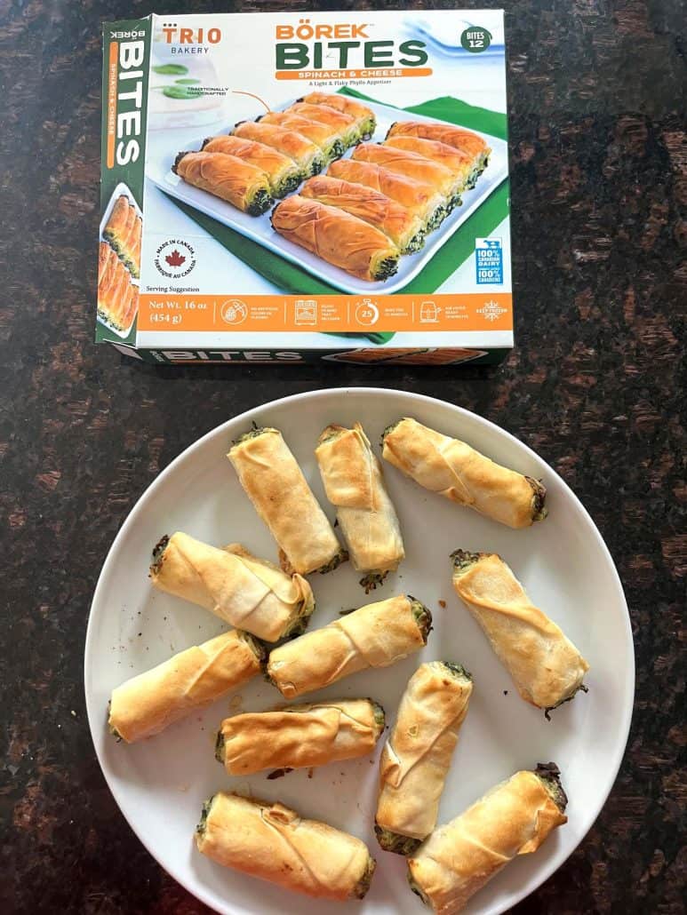 Plate of crispy air-fried borek bites served in front of the product box—showcasing the finished appetizer.