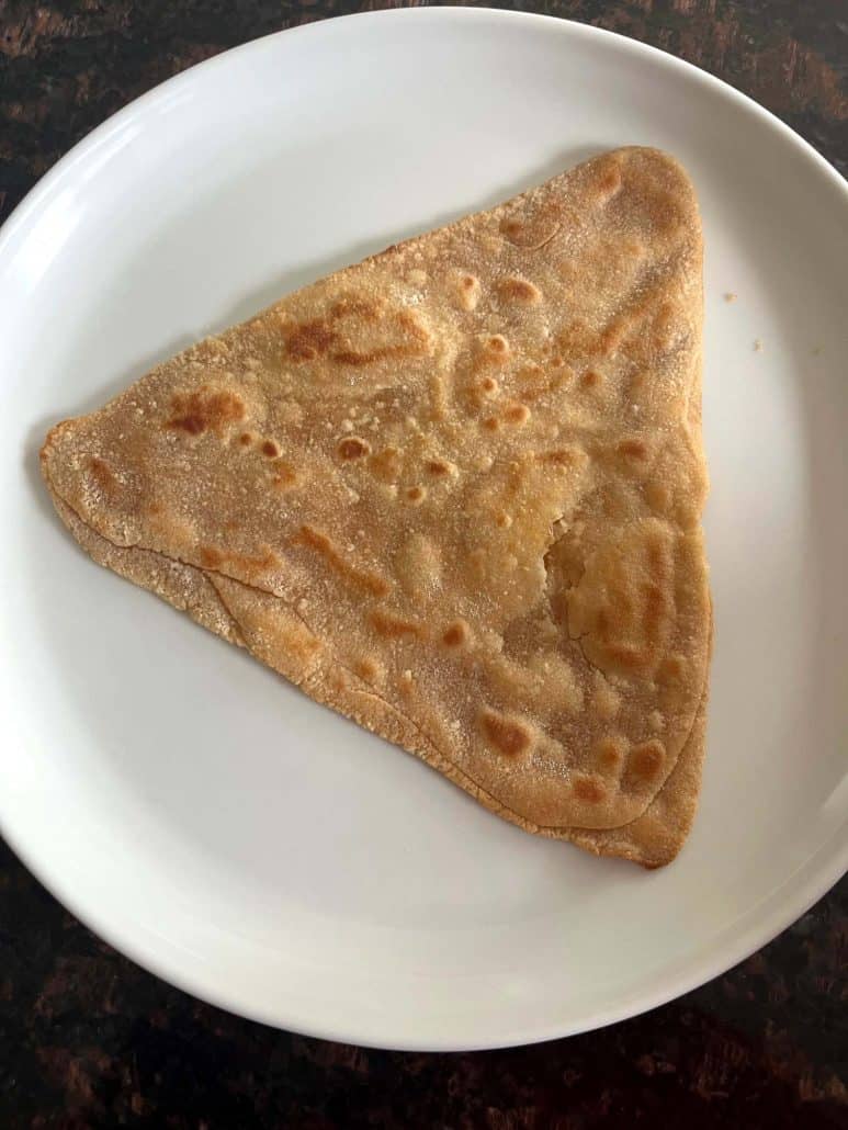 Cooked paratha served on a white plate—crispy on the outside and soft on the inside, ready to enjoy straight from the air fryer.
