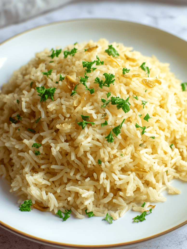 Plated fluffy garlic butter rice garnished with fresh parsley, showcasing a easy to make side dish.