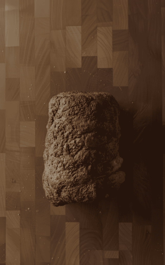 Perfectly roasted prime rib fresh out of the oven with a golden-brown seasoned crust.