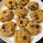 Plate of freshly baked pumpkin chocolate chip cookies – soft, fluffy, and packed with melty chocolate chips.