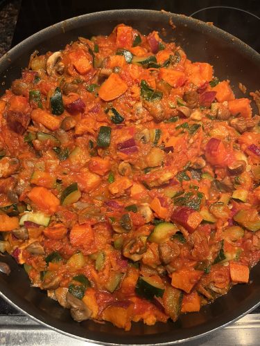 Healthy Sweet Potato Mushroom Zucchini Skillet Recipe Sweet Potato Mushroom and Zucchini Skillet cooking in a large pan.