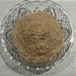 Bowl of creamy chopped liver spread made from sautéed onions and calf liver, ready to serve as a traditional Jewish appetizer.