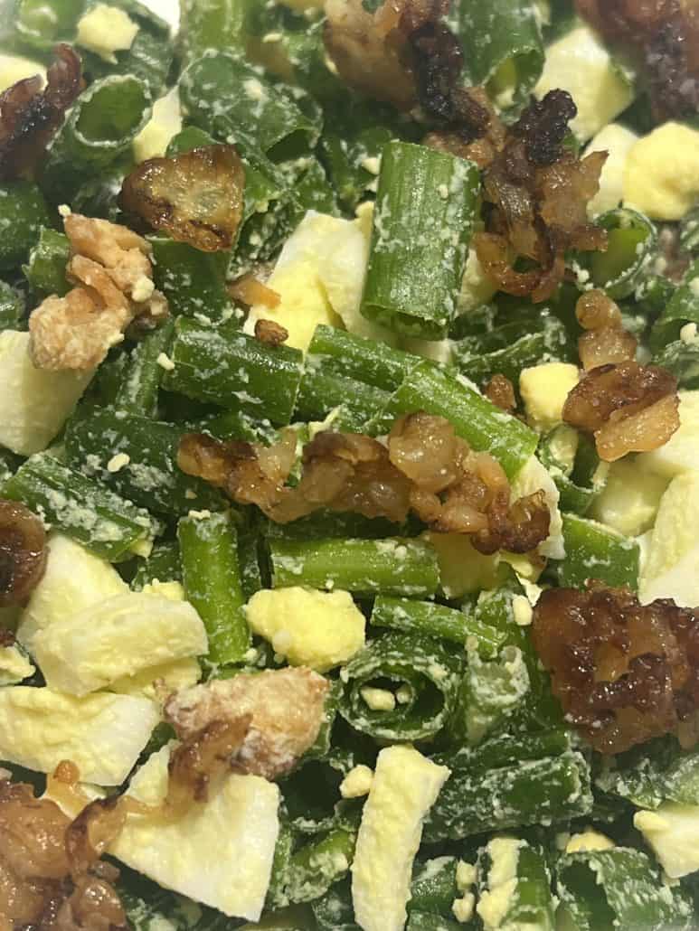 Close-up of chopped bacon, eggs, and green onions in Green Onion, Egg, and Bacon Salad. Highlighting the simple ingredients in this low-carb recipe.