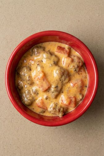 Cheesy Spicy Velveeta Rotel Sausage Dip Recipe Bowl of Velveeta spicy sausage dip, hot and ready to serve.