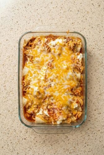 Easy Creamy Cottage Cheese Chicken Enchiladas Recipe Golden, cheesy Cottage Cheese Chicken Enchiladas baked in a 9x13 dish.