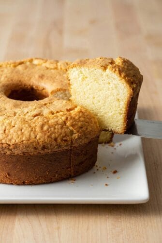 Moist Cream Cheese Pound Cake Recipe Sliced cream cheese pound cake on a plate, showcasing its light, dense texture.