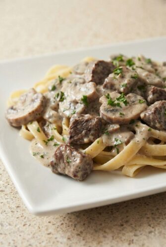 Tender and Creamy Slow Cooker Beef Stroganoff Recipe Creamy slow cooker beef stroganoff served over egg noodles, topped with tender beef chunks and sliced mushrooms in a rich mushroom sauce.