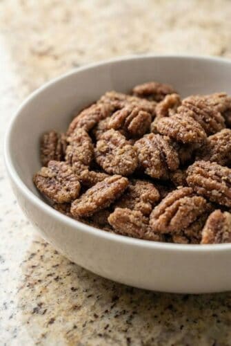 Texas Glazed Pecans Recipe – Sweet & Crunchy! Bowl of cinnamon glazed pecans, shown as a sweet and crunchy Texas candied pecan recipe.