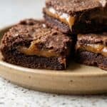 Chocolate caramel brownies with a gooey caramel center and chocolate topping.