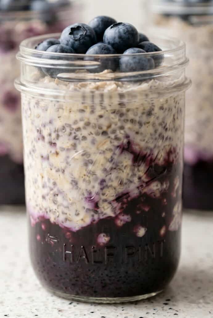 Close-up of blueberry overnight oats with a sweet blueberry layer in a jar, creamy make-ahead breakfast.