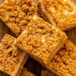 Butterscotch graham cracker cheesecake bars with a chewy crumble topping.