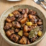 Pork Hamonado with caramelized pork belly and pineapple chunks, showcasing the sweet and savory Filipino dish.