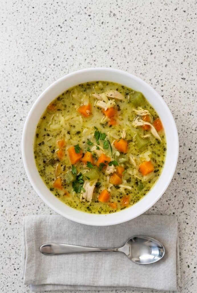 Overhead view of creamy turkey and rice soup in a bowl, an easy leftover turkey soup recipe with vegetables for cozy meals.