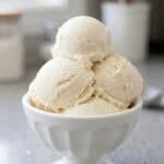 Creamy homemade vanilla ice cream scoops in a bowl, showcasing the easy 3-ingredient no-churn recipe.