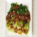 Bok choy with garlic soy sauce served on a plate.