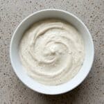Homemade garlic aioli mixed until smooth and creamy for dipping or spreading.