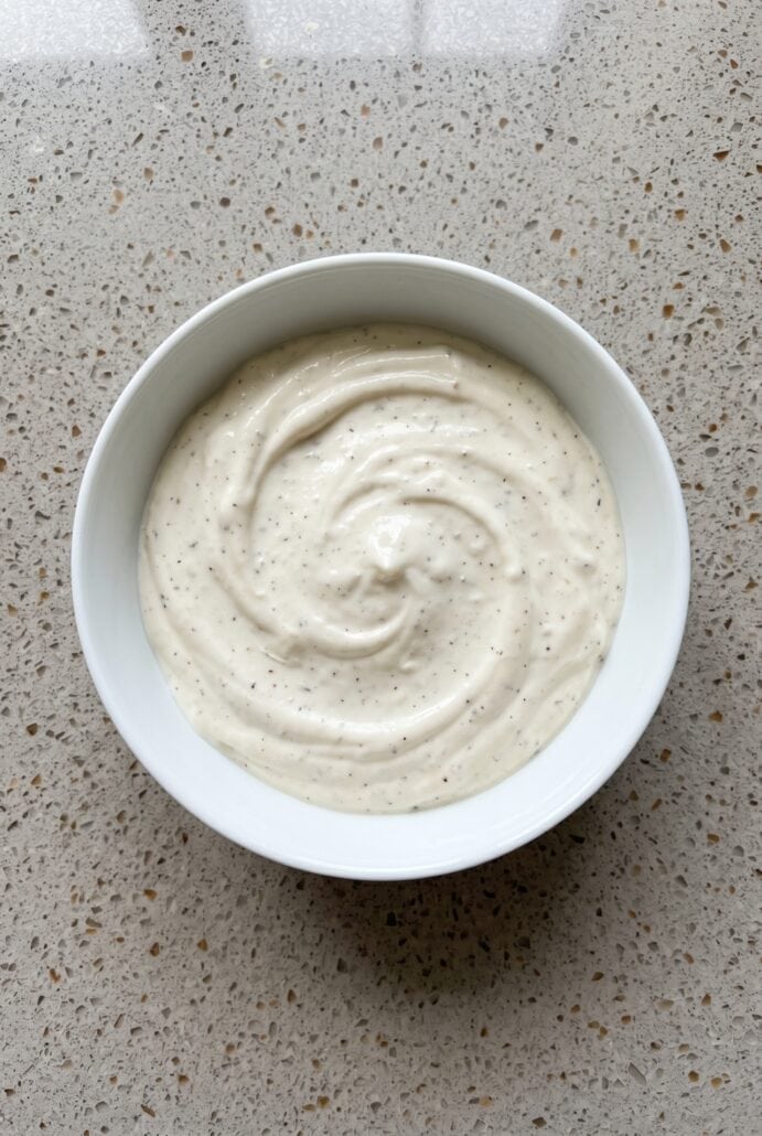 Homemade garlic aioli mixed until smooth and creamy for dipping or spreading.