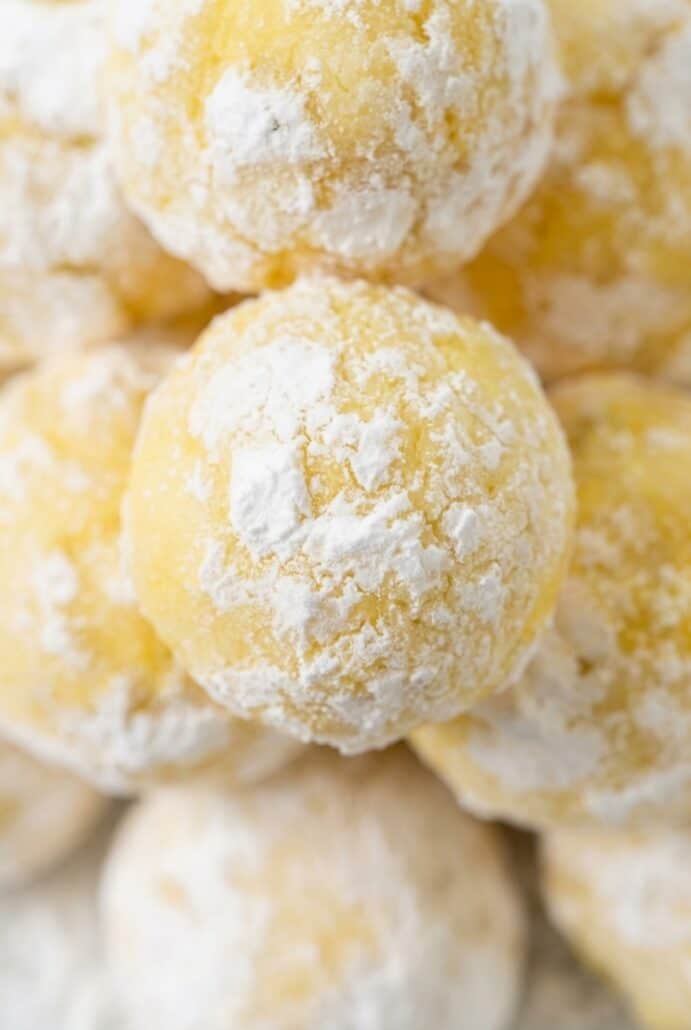Close-up of a powdered sugar-coated lemon white chocolate truffle.